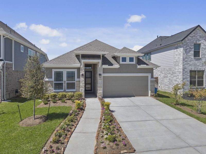 Front exterior of a new home in Sienna 45', Missouri City, TX, highlighting curb appeal (Image 1). Front exterior of a new home in Sienna 45', Missouri City, TX, highlighting curb appeal (Image 1).