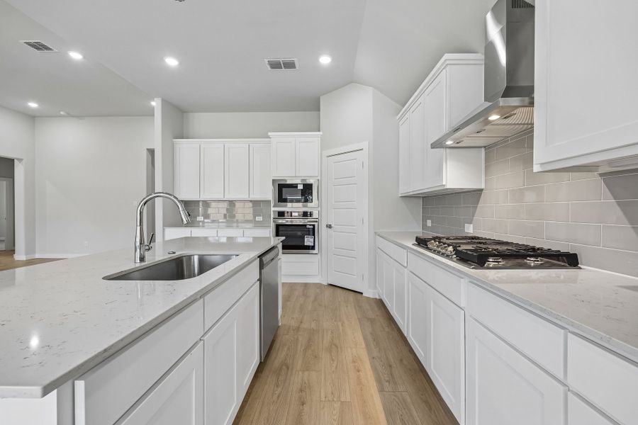 Kitchen in the Gilmour II home plan by Trophy Signature Homes