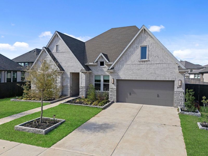 Front exterior of a new home in , Richmond, TX, highlighting curb appeal (Image 22).