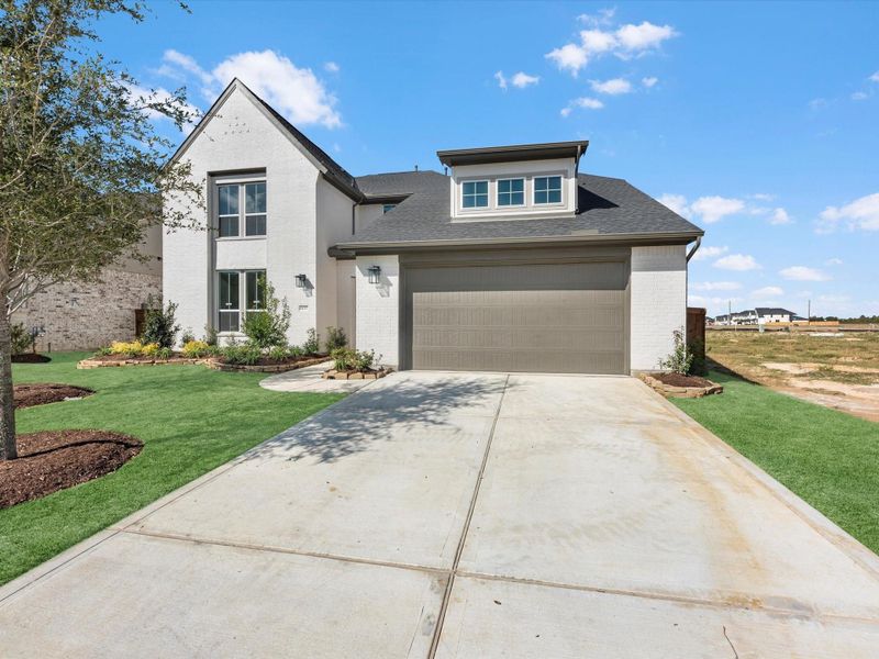 Front exterior of a new home in Dunham Pointe 60′, Cypress, TX, highlighting curb appeal (Image 1).