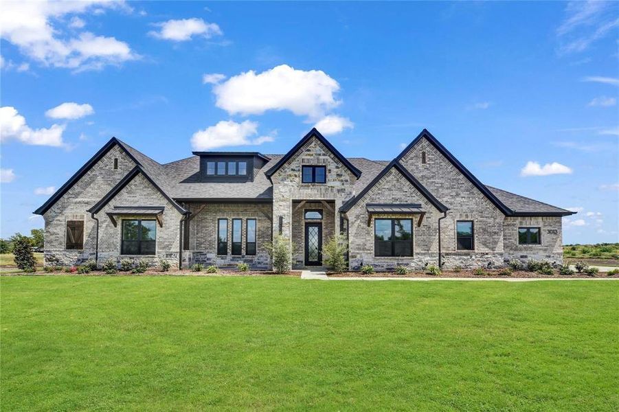 Front exterior of a new home in , Aledo, TX, highlighting curb appeal (Image 25). Front exterior of a new home in , Aledo, TX, highlighting curb appeal (Image 25).
