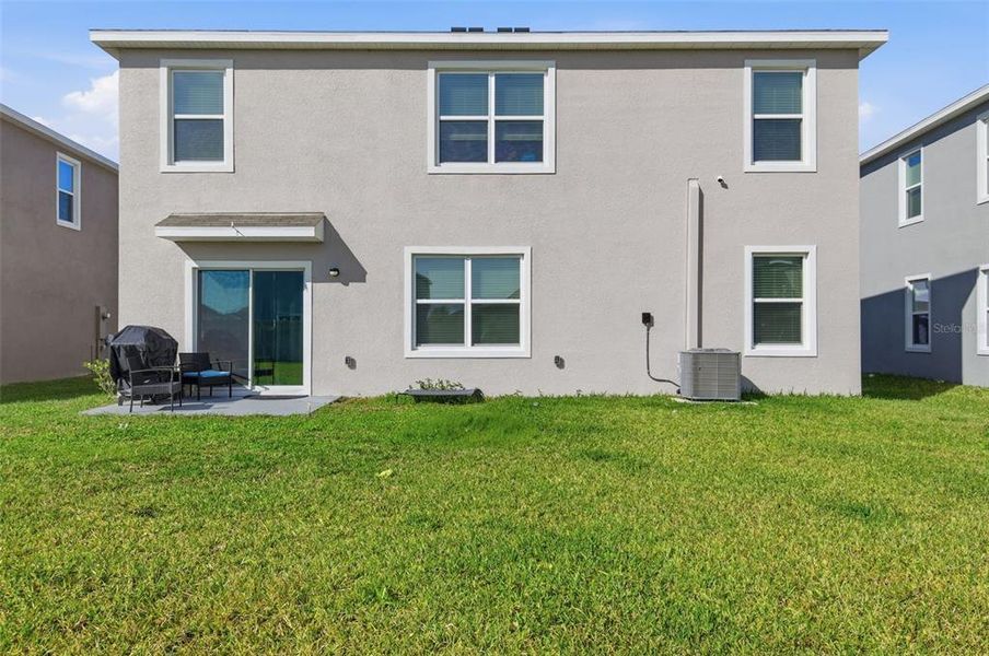 Exterior details and patio area of a home in Farm at Varrea, Plant City (Image 4).