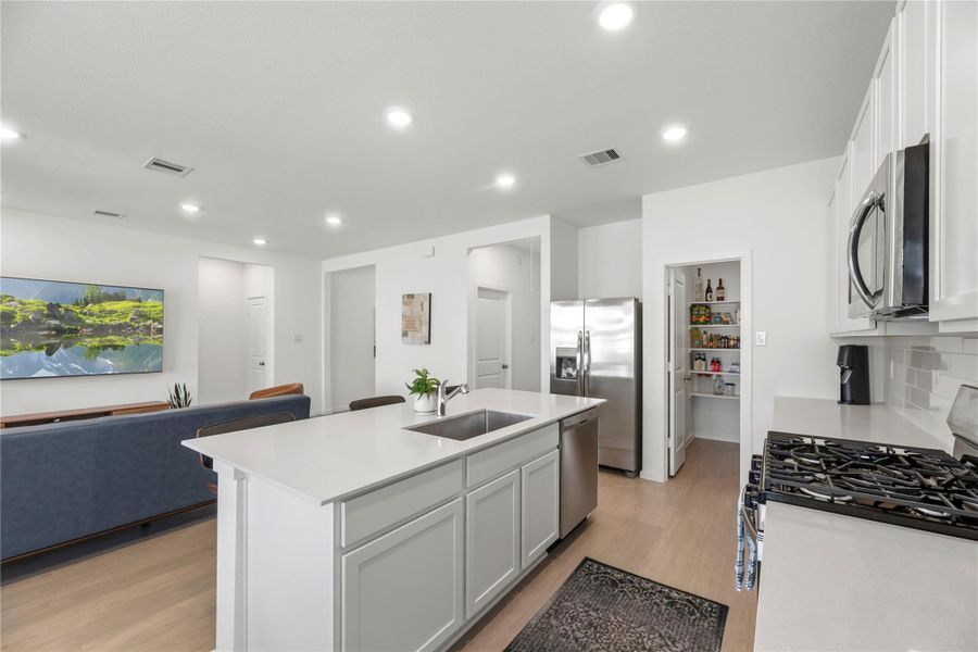 Open kitchen layout with clear sightlines to living and dining areas.