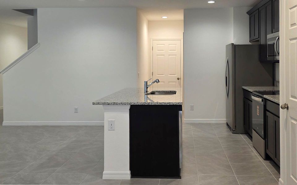Furnished interior view inside a new home in Blue Springs Reserve Townhomes, Groveland (Image 7). Furnished interior view inside a new home in Blue Springs Reserve Townhomes, Groveland (Image 7).