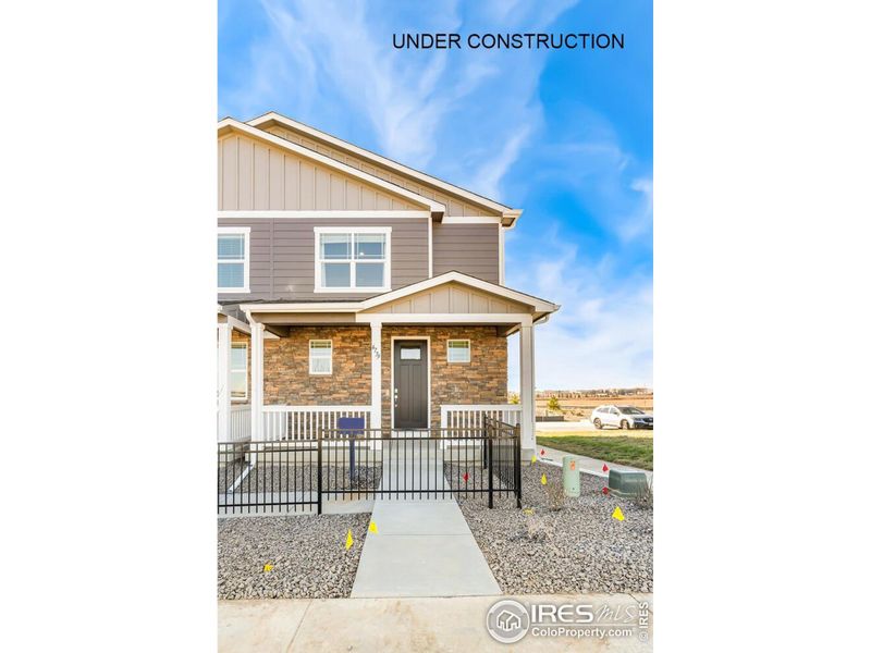 Front exterior of a new home in Revere at Johnstown, Johnstown, CO, highlighting curb appeal (Image 1). Front exterior of a new home in Revere at Johnstown, Johnstown, CO, highlighting curb appeal (Image 1).
