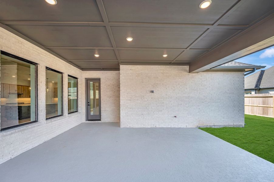 Exterior details and patio area of a home in Riceland - Enclave Collection, Mont Belvieu (Image 4). Exterior details and patio area of a home in Riceland - Enclave Collection, Mont Belvieu (Image 4).
