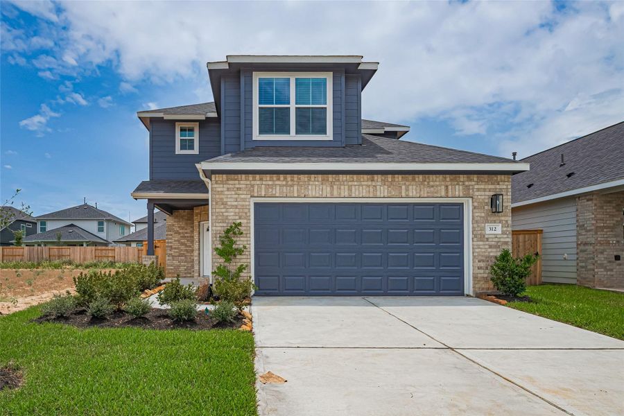 Front exterior of a new home in La Segarra, Brookshire, TX, highlighting curb appeal (Image 2).