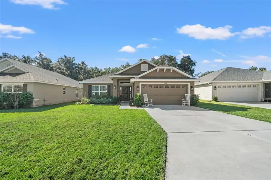 Front exterior of a new home in Wyld Palms, Inverness, FL, highlighting curb appeal (Image 2). Front exterior of a new home in Wyld Palms, Inverness, FL, highlighting curb appeal (Image 2).