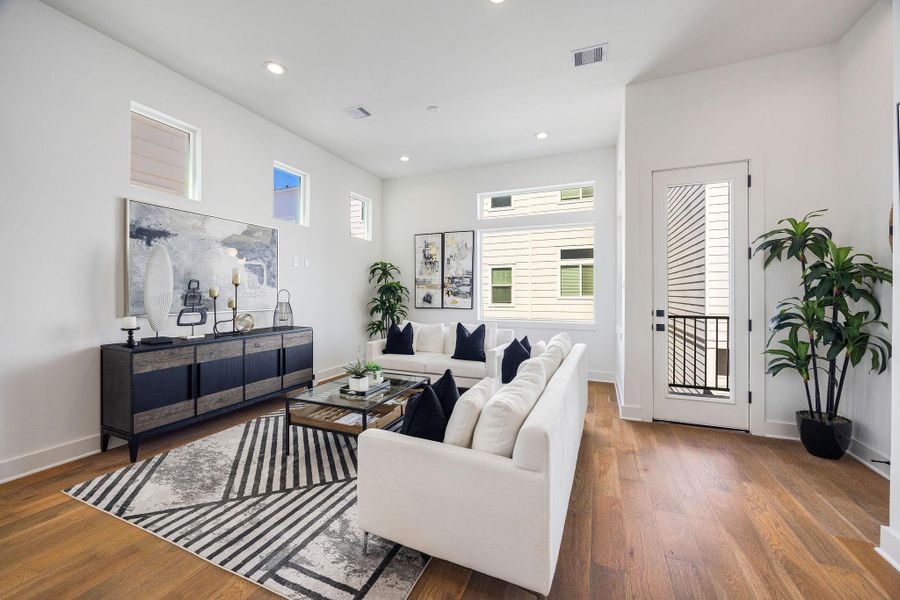 Another view of the living area and balcony perfect for entertaining and family gatherings.