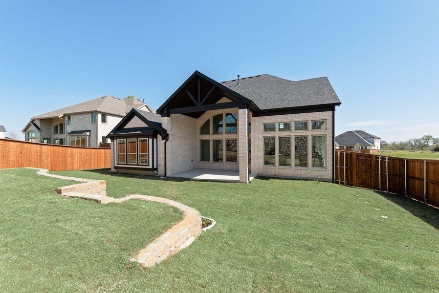 Exterior details and patio area of a home in Chatham Reserve, Providence Village (Image 3).