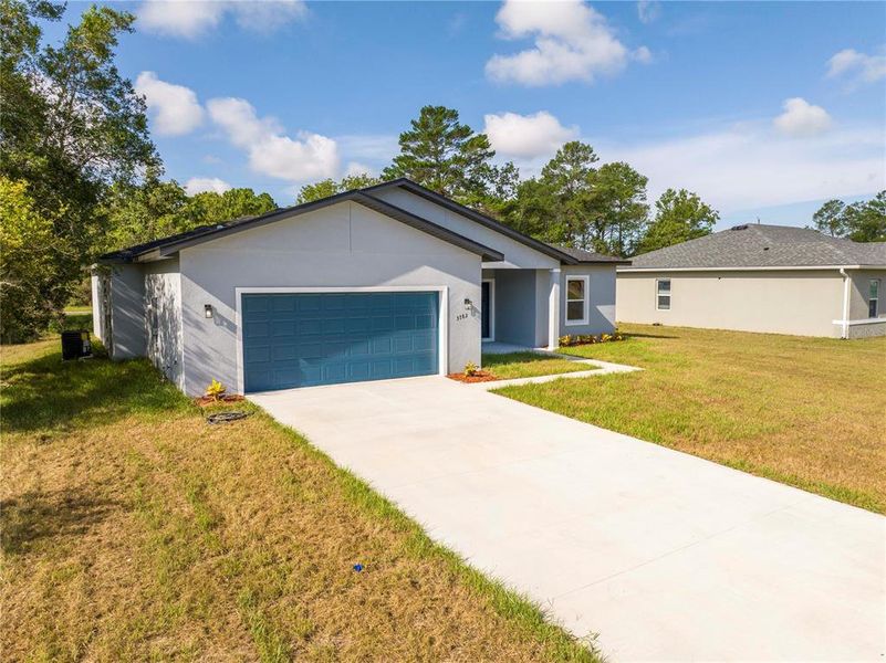 Front exterior of a new home in , Ocala, FL, highlighting curb appeal (Image 28).