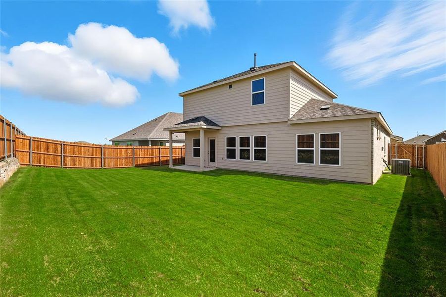 Rear view of house featuring a patio area, a fenced backyard, and a shingled roof Rear view of house featuring a patio area, a fenced backyard, and a shingled roof