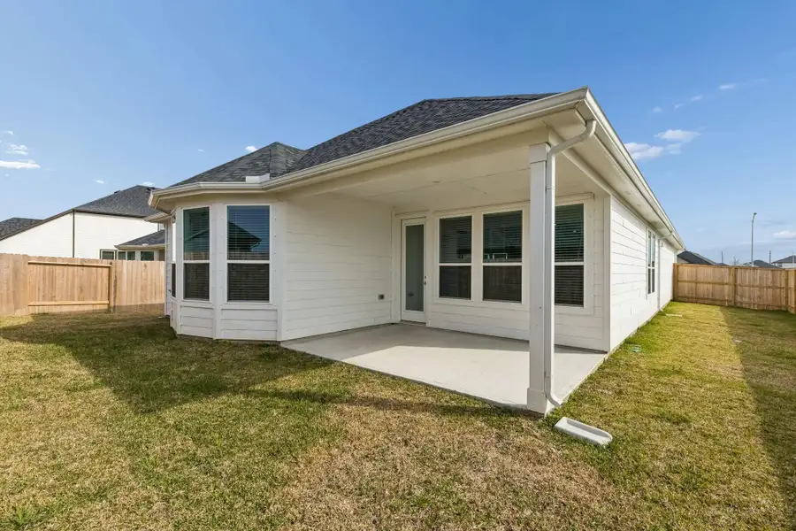 Exterior details and patio area of a home in Windcress, Cove (Image 3).