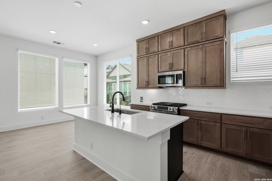 Furnished interior view inside a new home in Centero at Stone Oak, San Antonio (Image 18).