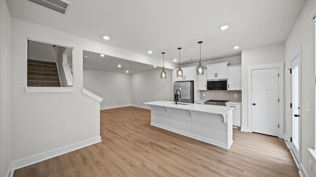 Open concept breakfast area adjacent from kitchen in two story townhome at Ransdell Pointe by DRB Homes in Spartanburg, SC Open concept breakfast area adjacent from kitchen in two story townhome at Ransdell Pointe by DRB Homes in Spartanburg, SC