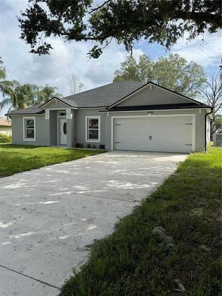 Front exterior of a new home in , Deltona, FL, highlighting curb appeal (Image 19).