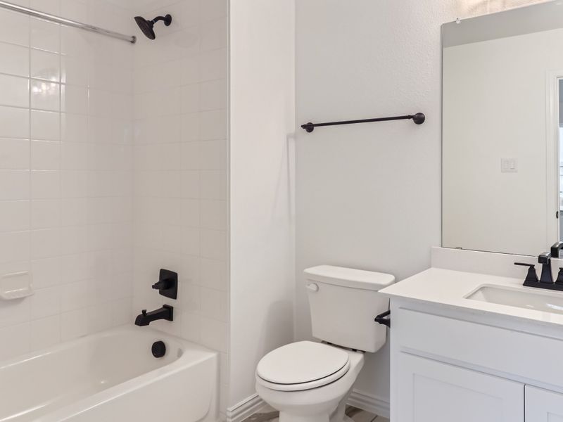 Plan 1542 Secondary Bathroom Representative Photo by American Legend Homes