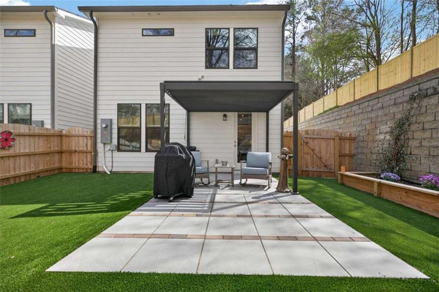Exterior details and patio area of a home in The Village at Towne Lake, Woodstock (Image 24).