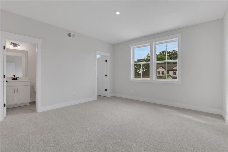 Spacious, unfurnished interior of a new home in The Paddocks at Doc Hughes, Buford (Image 37).