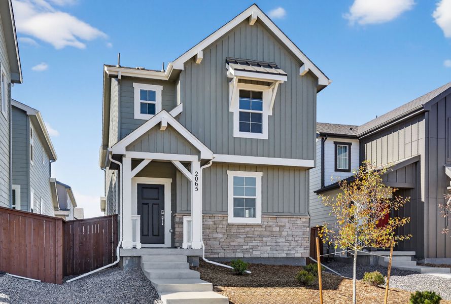 Front exterior of a new home in Farmlore, Brighton, CO, highlighting curb appeal (Image 1). Front exterior of a new home in Farmlore, Brighton, CO, highlighting curb appeal (Image 1).