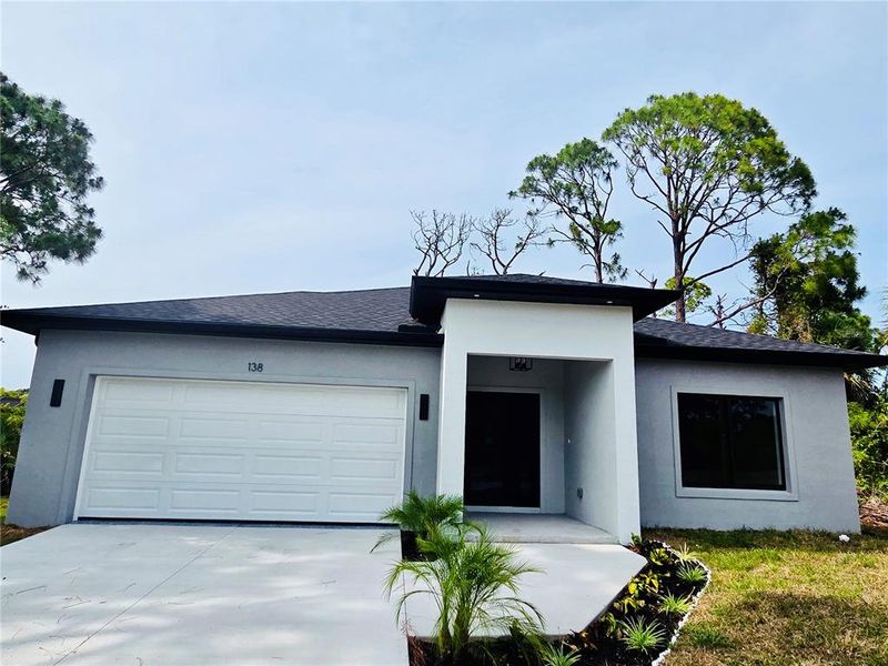 Front exterior of a new home in , Rotonda West, FL, highlighting curb appeal (Image 1). Front exterior of a new home in , Rotonda West, FL, highlighting curb appeal (Image 1).