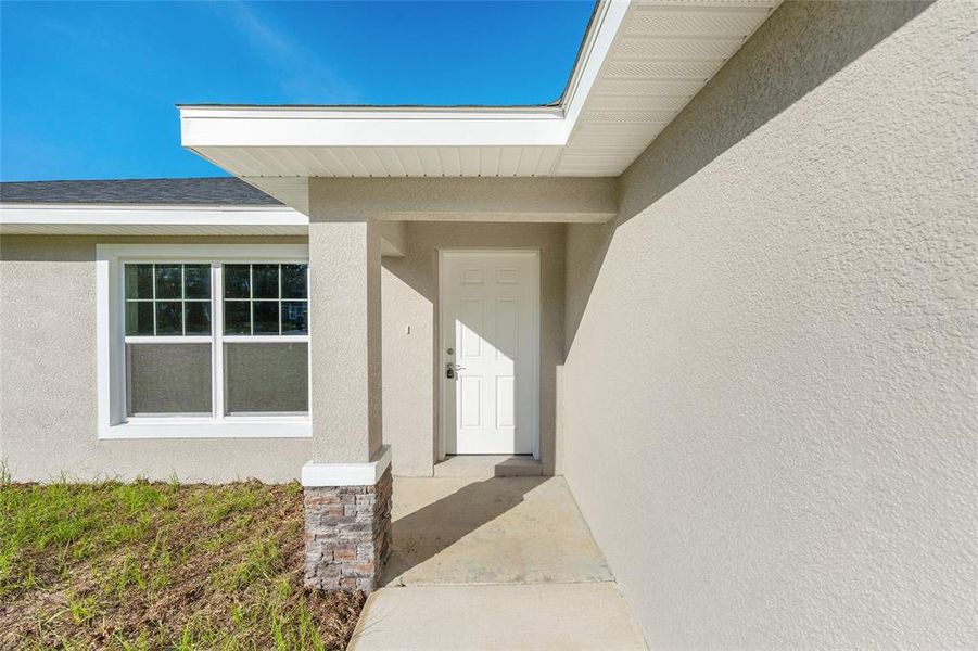 Front exterior of a new home in , Citrus Springs, FL, highlighting curb appeal (Image 1).
