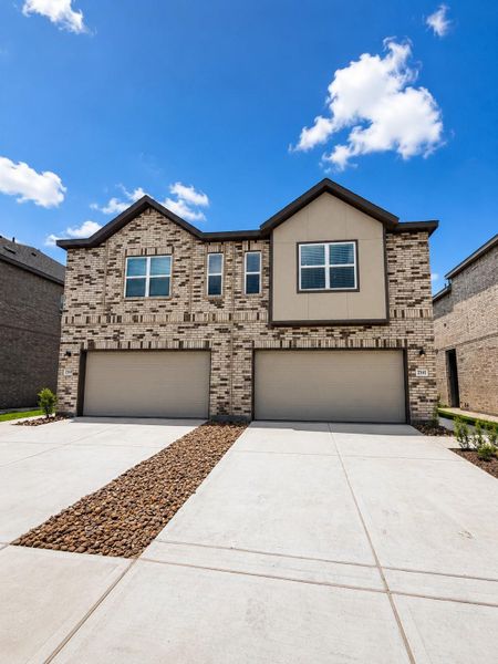 Front exterior of a new home in Sierra Vista, Rosharon, TX, highlighting curb appeal (Image 2).