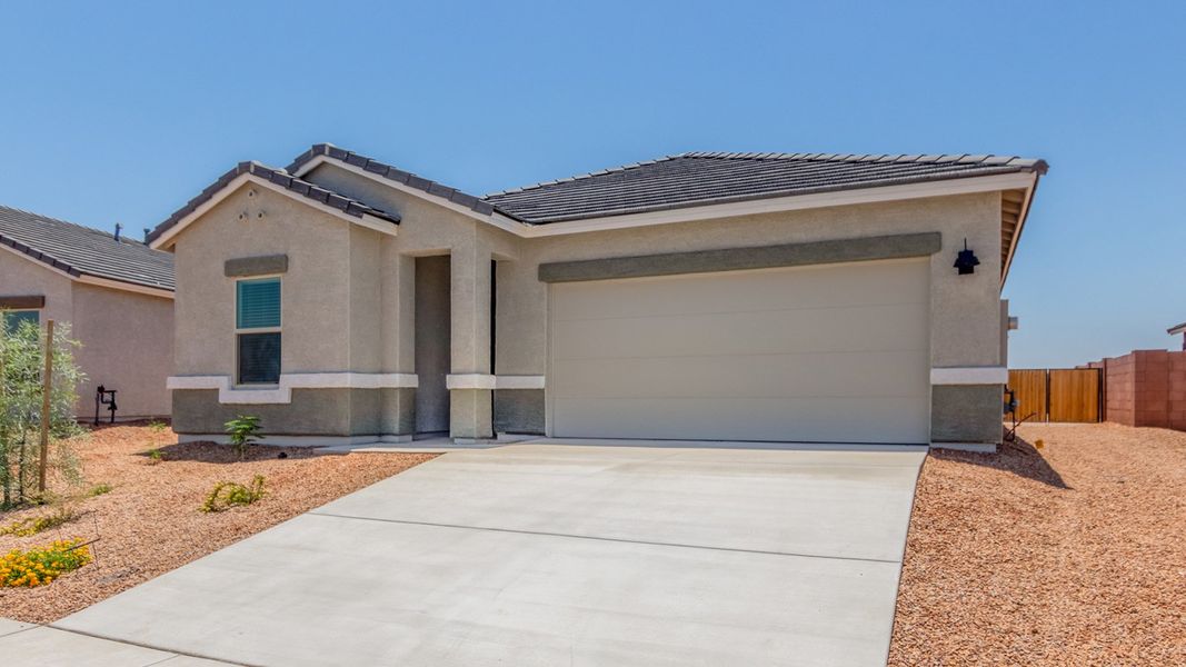 Front exterior of a new home in Barnett Village, Marana, AZ, highlighting curb appeal (Image 21).