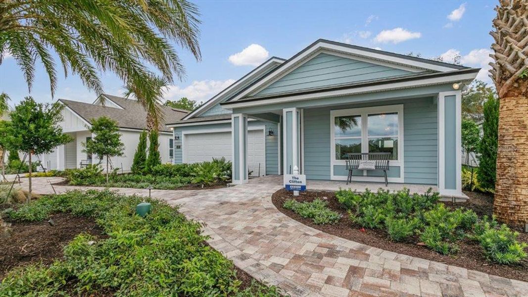 Front exterior of a new home in Sawmill Branch Express, Palm Coast, FL, highlighting curb appeal (Image 25).