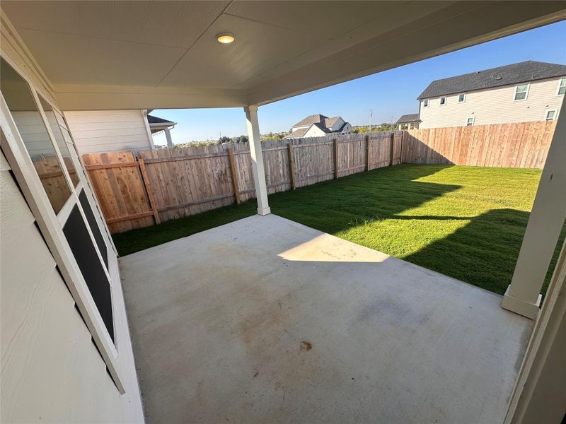 Fenced backyard featuring a patio Fenced backyard featuring a patio