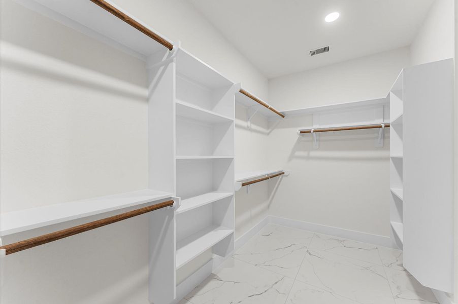 Primary bedroom walk-in closet Primary bedroom walk-in closet