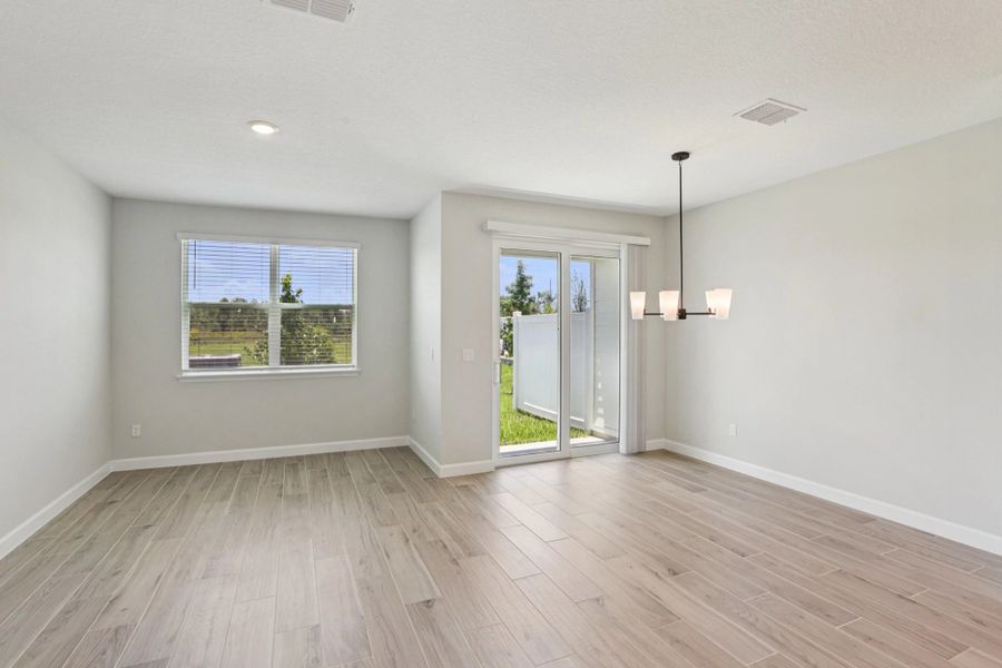 Open concept dining and family room - Representative images and renderings are for illustrative purposes