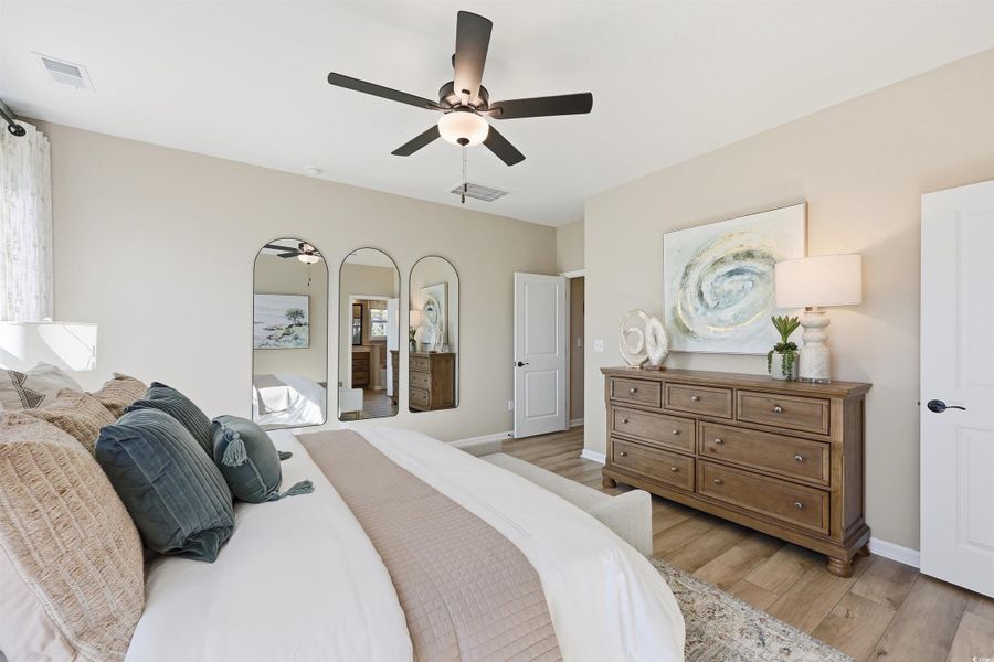 Bedroom featuring light wood-style floors and ceiling fan