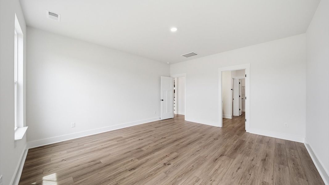 Elegant and functional primary suite in our reputable Iris Meadows community