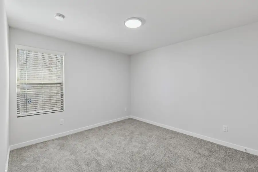 Bedroom in the Harrison home plan by Trophy Signature Homes – REPRESENTATIVE PHOTO Bedroom in the Harrison home plan by Trophy Signature Homes – REPRESENTATIVE PHOTO