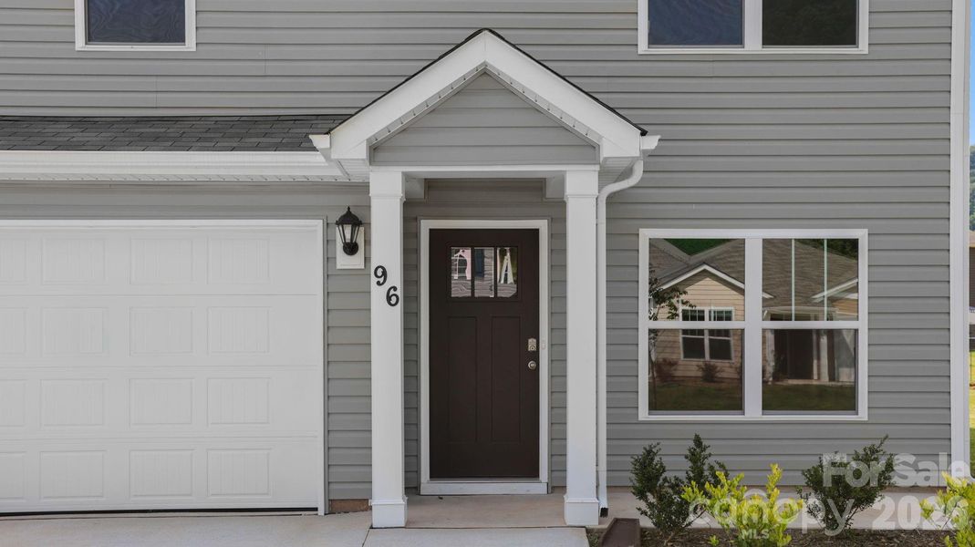 Exterior details and patio area of a home in Wildbrook Village, Waynesville (Image 3).
