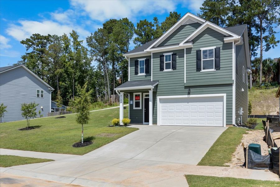 Front exterior of a new home in Forrest Bluff, North Augusta, SC, highlighting curb appeal (Image 17). Front exterior of a new home in Forrest Bluff, North Augusta, SC, highlighting curb appeal (Image 17).