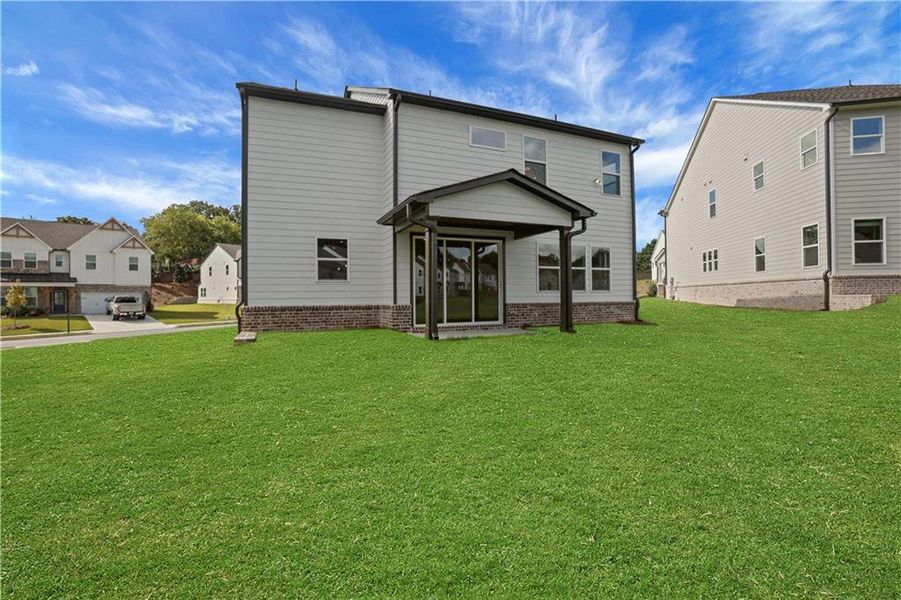 Exterior details and patio area of a home in The Paddocks at Doc Hughes, Buford (Image 30).