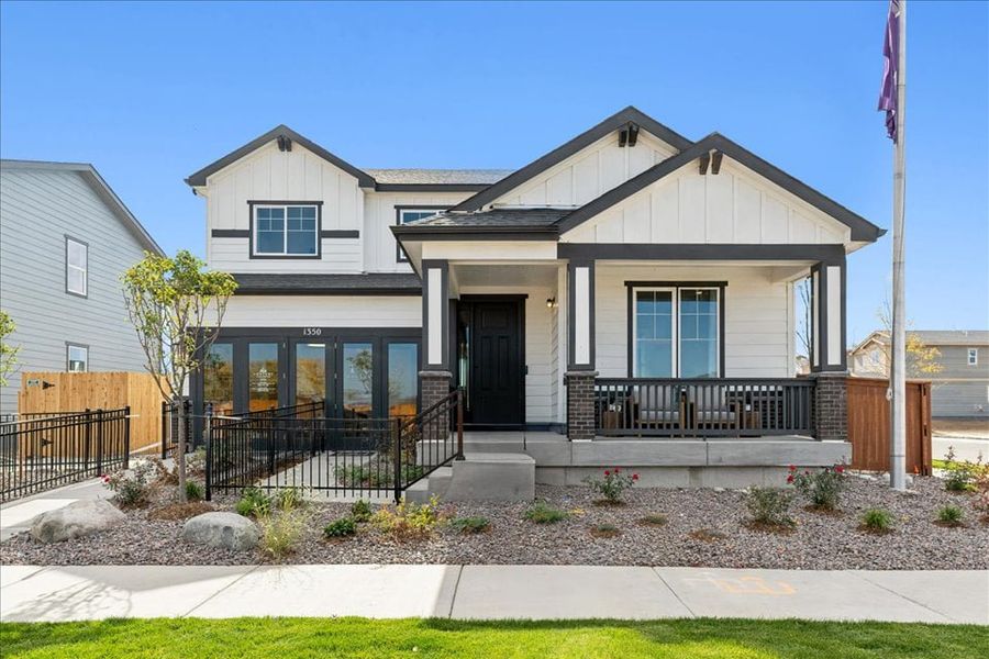Front exterior of a new home in Farmlore, Brighton, CO, highlighting curb appeal (Image 1). Front exterior of a new home in Farmlore, Brighton, CO, highlighting curb appeal (Image 1).