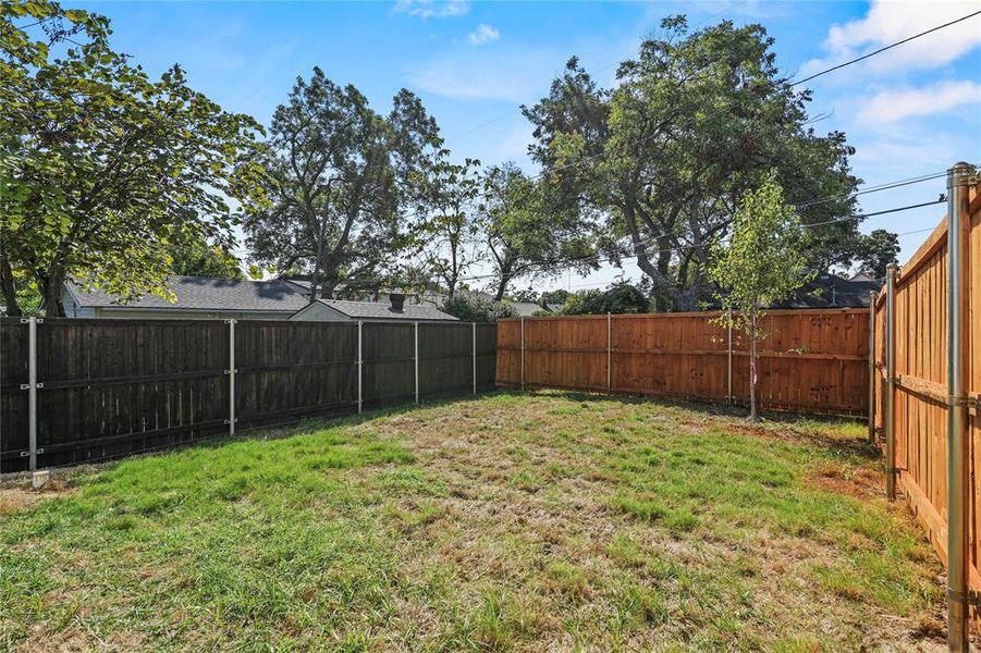 View of fenced backyard