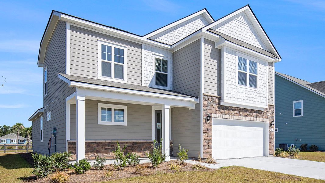 Front exterior of a new home in Auberon Woods, Conway, SC, highlighting curb appeal (Image 2).