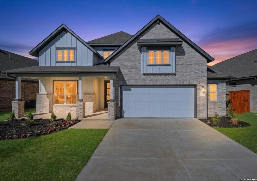 Front exterior of a new home in Megan's Landing, Castroville, TX, highlighting curb appeal (Image 24).