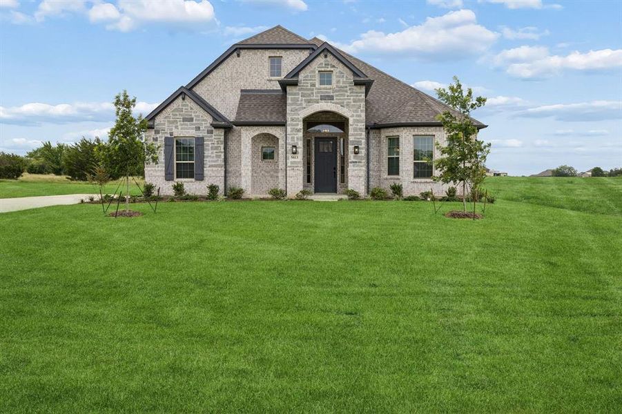 Front exterior of a new home in Joshua Meadows, Joshua, TX, highlighting curb appeal (Image 21). Front exterior of a new home in Joshua Meadows, Joshua, TX, highlighting curb appeal (Image 21).