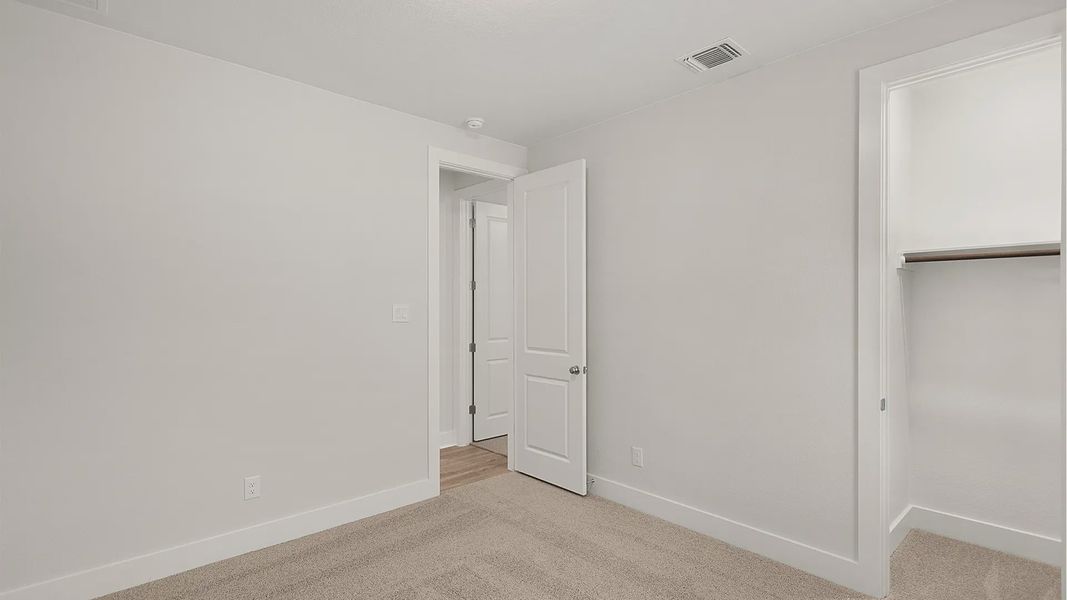 Representative unfurnished interior of a home built from the Brenner by Chesmar Homes in Newhaven, Manor (Image 31).