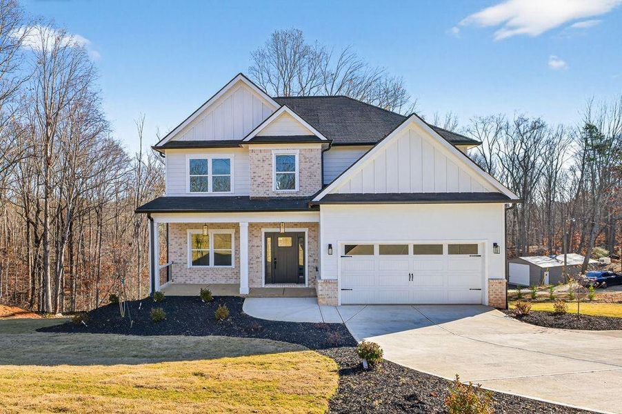 Front exterior of a new home in , Flowery Branch, GA, highlighting curb appeal (Image 25).
