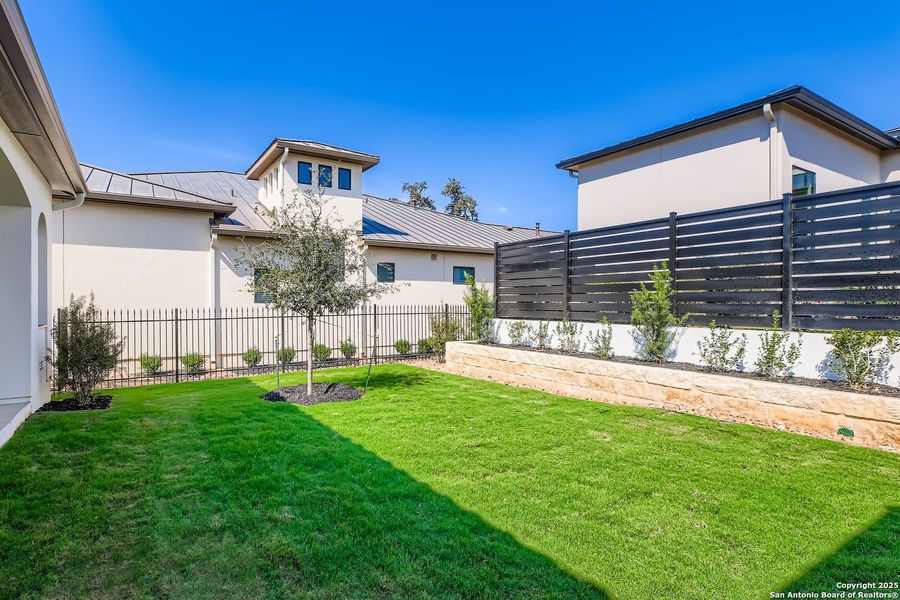 Exterior details and patio area of a home in The Bluff At The Dominion, San Antonio (Image 25).