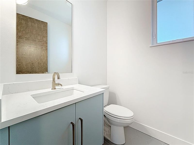 Main-level powder room for guests. Main-level powder room for guests.