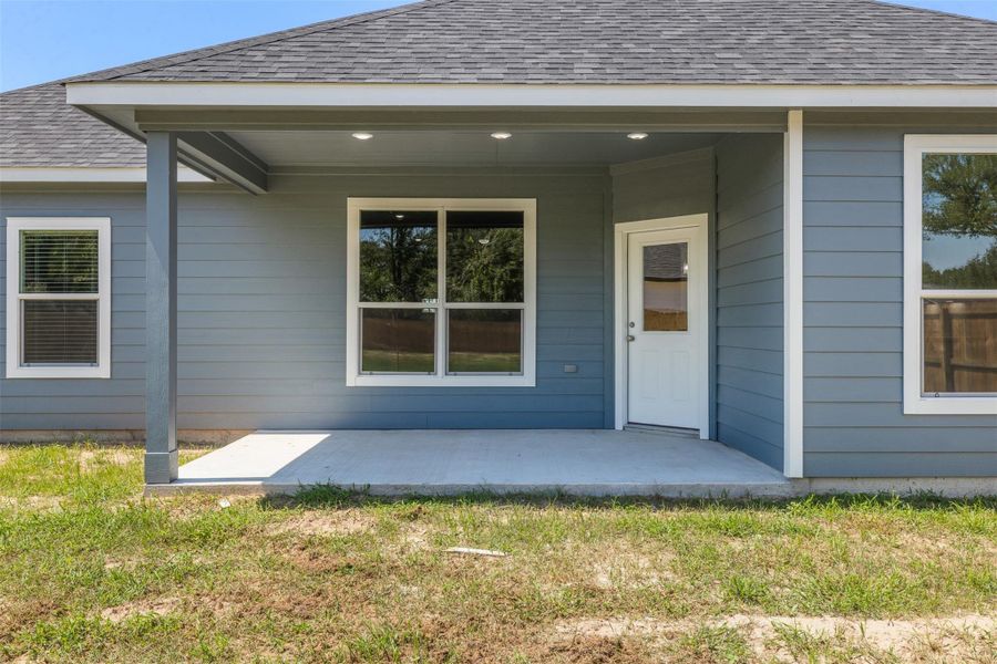Front exterior of a new home in , Columbus, TX, highlighting curb appeal (Image 21).