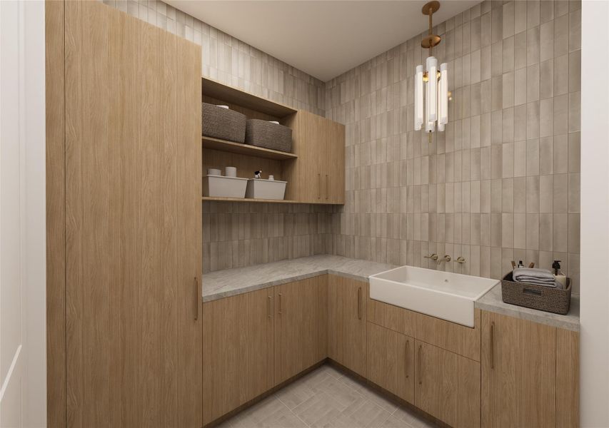A masterclass in understated elegance, this utility room layers organic textures and modern lines with intention. Generous storage, a deep apron-front sink, and curated finishes redefine what it means to design every square inch with care. A masterclass in understated elegance, this utility room layers organic textures and modern lines with intention. Generous storage, a deep apron-front sink, and curated finishes redefine what it means to design every square inch with care.