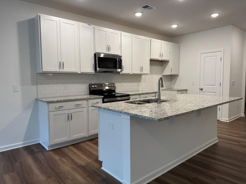 Furnished interior view inside a new home in East Main Townes, Spartanburg (Image 4). Furnished interior view inside a new home in East Main Townes, Spartanburg (Image 4).